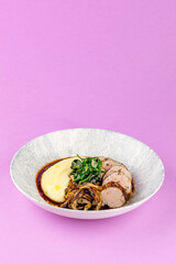 meat with mashed potatoes in a plate