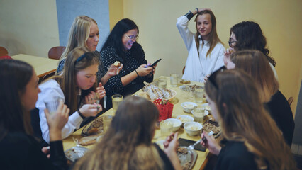 High school children eat in the school canteen.