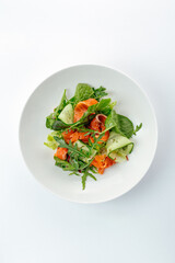 salad with salmon, vegetables and sauce