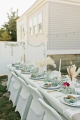 Boho Wedding decor with candle sticks, green accents, pampas grass