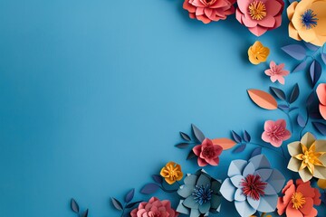 Artistic display of colorful paper flowers on electric blue background