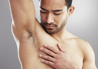 Man, armpit and muscle or healthy hygiene on studio grey background for wellness, skincare or...