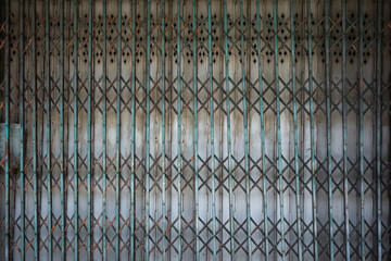 green rusty old antique slide steel door folding metal grille gate