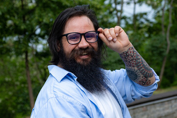 portrait of a man in glasses. Aitishnik on a walk