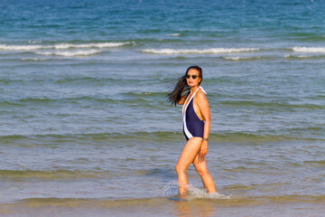 Woman body beautiful with bikini relax on beach
