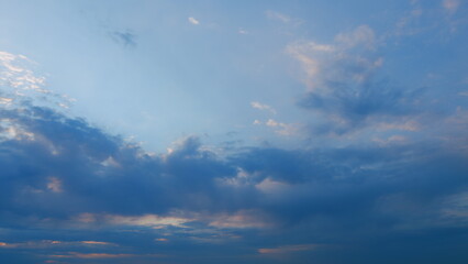 Intense dramatic panoramic sunset. Abstract different shades clouds at sunset sky background....