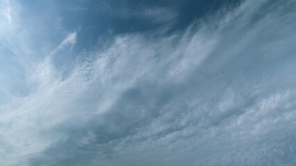 Fluffy layered clouds sky atmosphere. Puffy fluffy white clouds. Formation cloud sky scape....