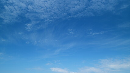 White cirrus cloudscape on beautiful sunny clear sky. Tropical summer sunlight. Timelapse.