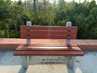 Beautiful concrete garden bench in red color