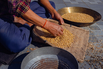 Manual pulse Grain or Soyabean Dal Cleaning: Using Stainer or Channi - Uttarakhand, India