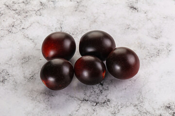 Raw ripe black kumato tomato
