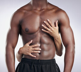 Hands, muscular and body of black man in studio for body building exercise with jeans for fashion....