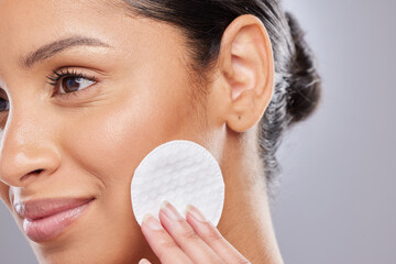 Cotton swab, skincare and woman in studio with natural, health and fresh facial treatment. Smile,...