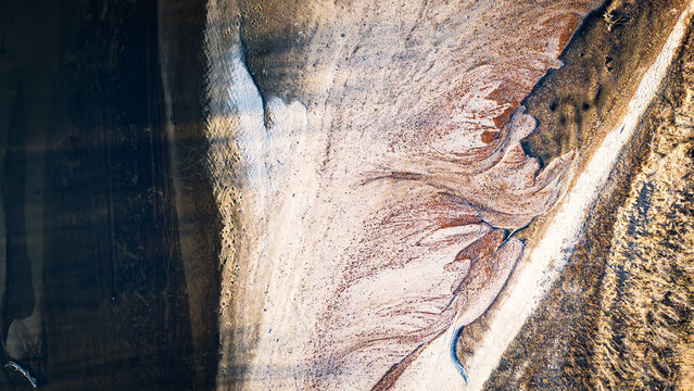 Ethereal Aerial View: River Meets Sands on Iowa's Riverside Journey