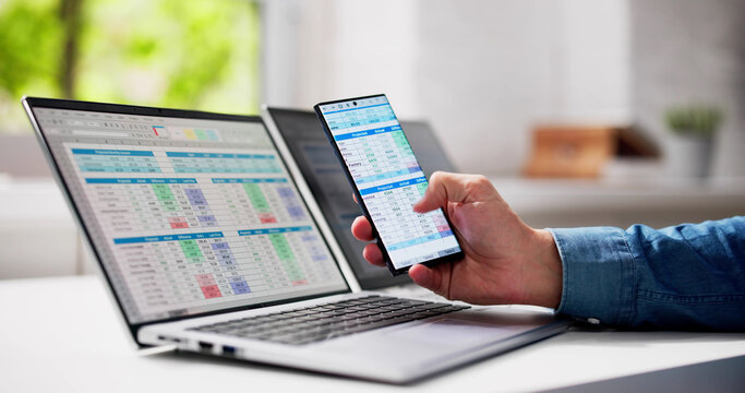 Man Using Spreadsheet Data