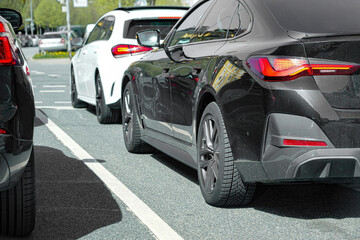 Obraz premium Cars in a traffic jam on the road. Automotive industry.