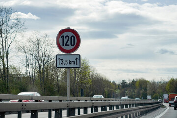 Car speed limit 120 sign on the autobahn. Automotive industry.