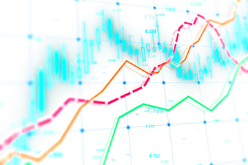 Obraz premium A blurred image showing colorful financial stock market charts on a light background, representing data analysis
