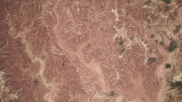 Top view of an extreme arid terrain of a desert