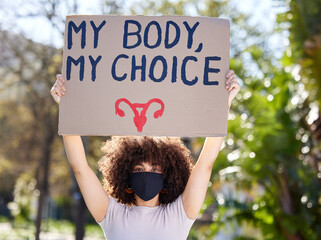 Woman, portrait and poster for outdoor protest on abortion, body choice or freedom of human rights....
