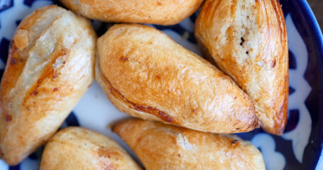 Delicious Uzbek Samsa with lamb and spices cooked in tandoor.