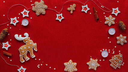 Holiday Cheer with Festive Gingerbread Decorations. A Vibrant Red Background Adorned with Traditional Christmas Cookies and lights