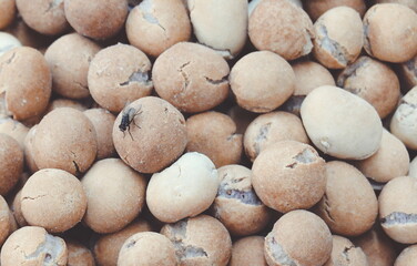 Closeup Of Peanuts With Fly On Top Textured Background
