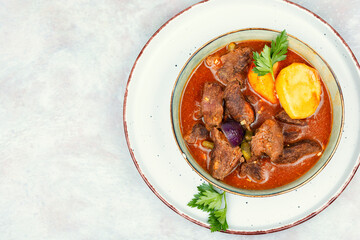 Roast venison with potatoes.