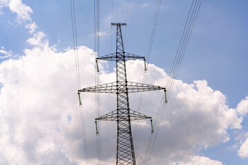 High voltage towers with sky background. Power line support with wires for electricity...