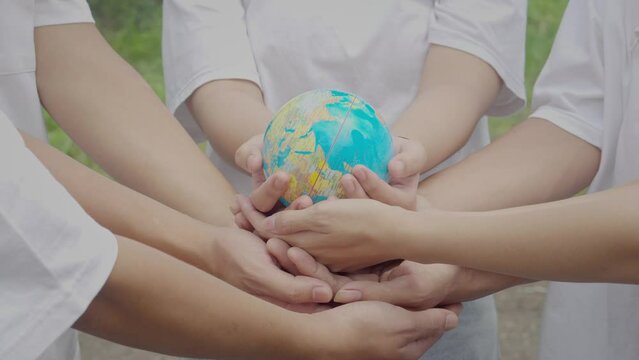 Unity to Save The World. Diverse Hands Holding Globe. Save The Planet, Earth Day.