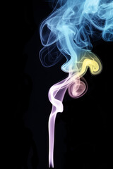 Vivid smoke trails in blue, purple, and yellow against black background
