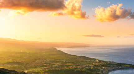 picturesque view to a sunset sea gulf with beautiful mountains and amazing cloudy sky on background of nice travel landscape