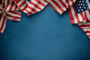 Fototapeta na wymiar Flag display on a patriot blue background, celebrating Memorial Day.