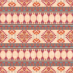 Thai tribal art seamless textile patterns with vibrant motifs feature red, orange, and blue colors. Bright color ethnic abstract geometric pattern design for fabric, textile, sarong, and carpet.