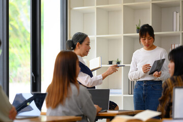 Asian female student having presentation in college classroom