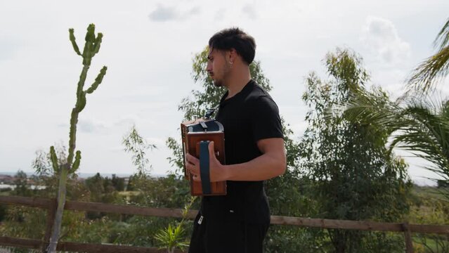 Musician Boy Plays Tarantella Music Calabria With Accordion Instrument Outdoor