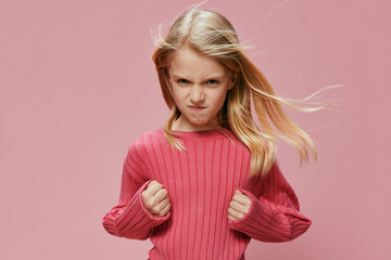 Happy Schoolgirl with Stylish Pink Outfit and Thoughtful Expression A beautiful, cheerful...