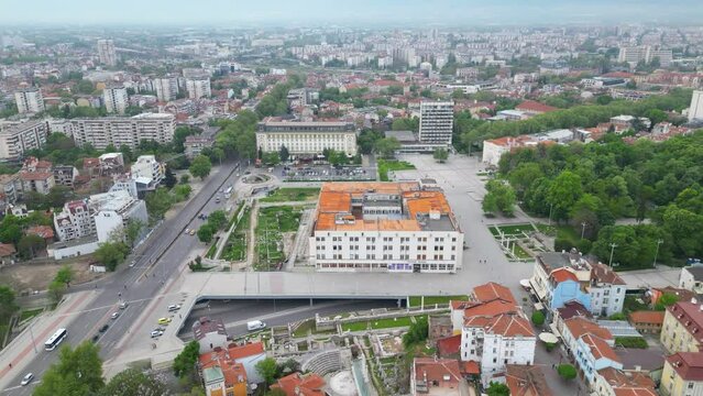 Aerial drone shot of Plovdiv city center. Ancient city in Bulgaria seen from above during a cloudy morning. Flyover footage of the Touristing city of Philippopolis in Thracia. Old Town. Tepe visible
