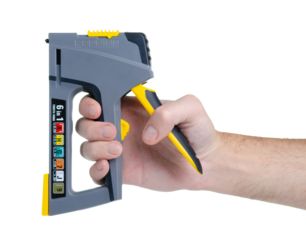Construction stapler gun work tool in hand on white background isolation