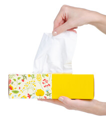 Yellow pack box of wipes paper tissue in hand on white background isolation