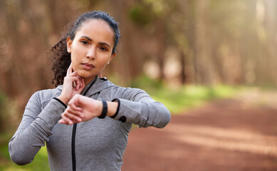 Woman, resting and check pulse in nature for intensity, fitness and wellness in forest. Brazilian runner, taking break and counting bpm from workout, challenge and goals in woods with copy space