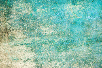 A blue and white background with a few specks of color