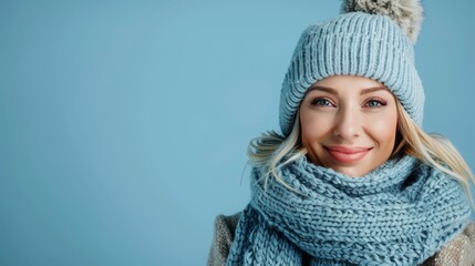 Smiling woman in winter hat and scarf, great for fashion and seasonal advertising.
