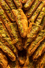 Pistachio baklava dessert as background. Traditional Turkish cuisine delicacies. Close-up Pistachio...