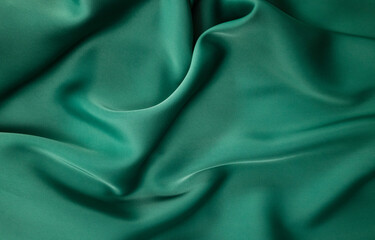 beautiful, abstract green fabric with pleasant draperies.