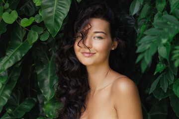 Fashion Tropical Portrait of Young Woman in the Jungle Among Exotic