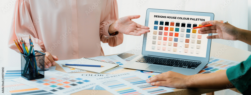 Poster creative graphic design presents selective color while manager using laptop comparing suitable color
