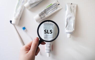 Dangerous toothpaste ingredient SLS, sodium laureth sulfate. Checking the composition of toothpaste...