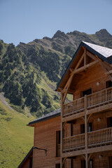 Wooden chalet with mountin views behind