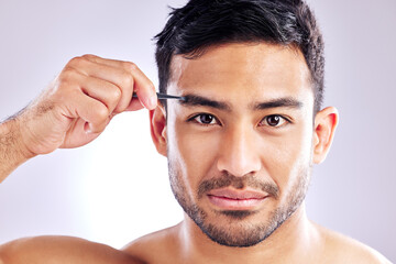 Serious, portrait and man with tweezer for eyebrow, studio and routine in morning, aesthetic and...